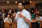 Actor Kal Penn and former White House official Aneesh Chopra talk with Obama supporters in Arlington
