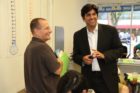 Actor Kal Penn and former White House official Aneesh Chopra talk with Obama supporters in Arlington