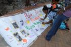 A candlelight vigil was held in the Hall's Hill community for homicide victims Keefe Spriggs and Carl Moten