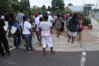 A candlelight vigil was held in the Hall's Hill community for homicide victims Keefe Spriggs and Carl Moten