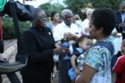 A candlelight vigil was held in the Hall's Hill community for homicide victims Keefe Spriggs and Carl Moten