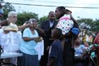 A candlelight vigil was held in the Hall's Hill community for homicide victims Keefe Spriggs and Carl Moten
