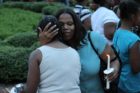 A candlelight vigil was held in the Hall's Hill community for homicide victims Keefe Spriggs and Carl Moten