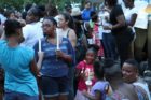 A candlelight vigil was held in the Hall's Hill community for homicide victims Keefe Spriggs and Carl Moten