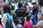 A candlelight vigil was held in the Hall's Hill community for homicide victims Keefe Spriggs and Carl Moten
