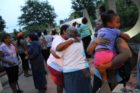 A candlelight vigil was held in the Hall's Hill community for homicide victims Keefe Spriggs and Carl Moten