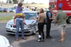 The driver of a vehicle that collided with an ACPD cruiser talks to a witness