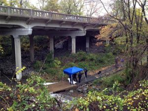 Police investigate a likely suicide on the Four Mile Run Trail under Columbia Pike (photo courtesy Devin L.)
