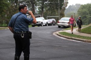 A police officer keeps watch during Walk and Bike to School Day 2012 at Oakridge Elementary School