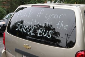 Words of protest seen on the back of a minivan, outside Oakridge Elementary School