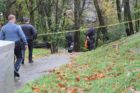 Police investigate a likely suicide on the Four Mile Run Trail under Columbia Pike