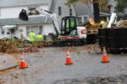 Workers remove fallen tree from Washington Blvd at N. Utah Street