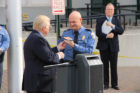 Neal Nichols hands vehicle keys to Chief Scott