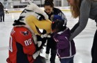 Washington Capitals mascot Slapshot greets children on the ice at Kettler Capitals Iceplex during Monumental Sports & Entertainment’s Family-to-Family holiday party