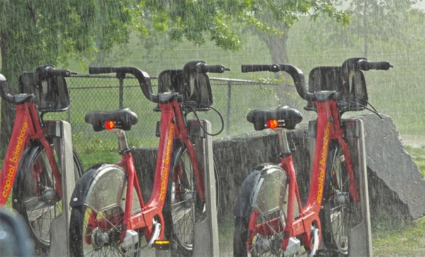 Capital Bikeshare in the rain by Wolfkann