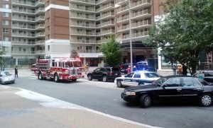 Police and firefighters on scene of a woman who fell from Randolph Towers in Ballston (photo courtesy @zippychance)