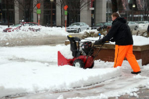 Workers clear sidewalks during snowstorm in Ballston