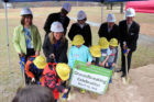 Students help APS officials at the new elementary school at Williamsburg groundbreaking