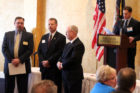 Lt. Mark Belanger, second from left, receives the OEM Meritorious Service Award