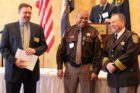Sgt. Kevin Pope, center, receives the Sheriff's Office Meritorious Service Award