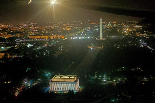 View of Washington D.C. and monuments at night, as seen from an arriving flight (Flickr pool photo by Wolfkann)