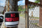 A no trespassing sign at 6875 Lee Highway, where part of a W&OD trestle was torn down