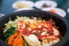 Bibimbap combines rice, meat, vegetables and sauces. (via Flickr/Pen Waggener)