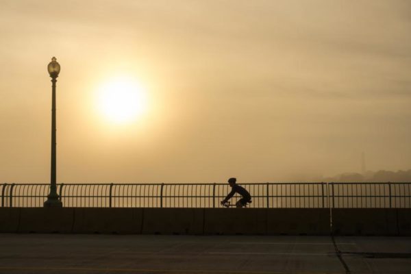 Bicyclist and morning fog (Flickr pool photo by Wolfkann)