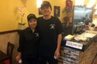 Owner Zhong Lin, left, with his wife at Lucky Pot restaurant in Courthouse