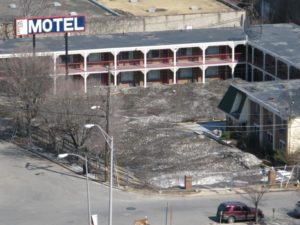 Expanse of filthy, melting snow at former Crystal City Motel