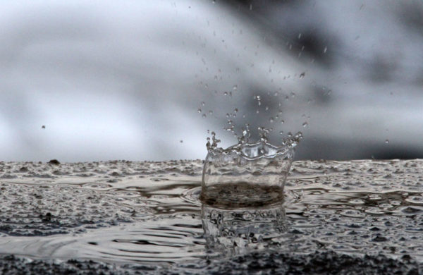A drop of melting snow makes a tiny splash A drop of melting snow makes a tiny splash