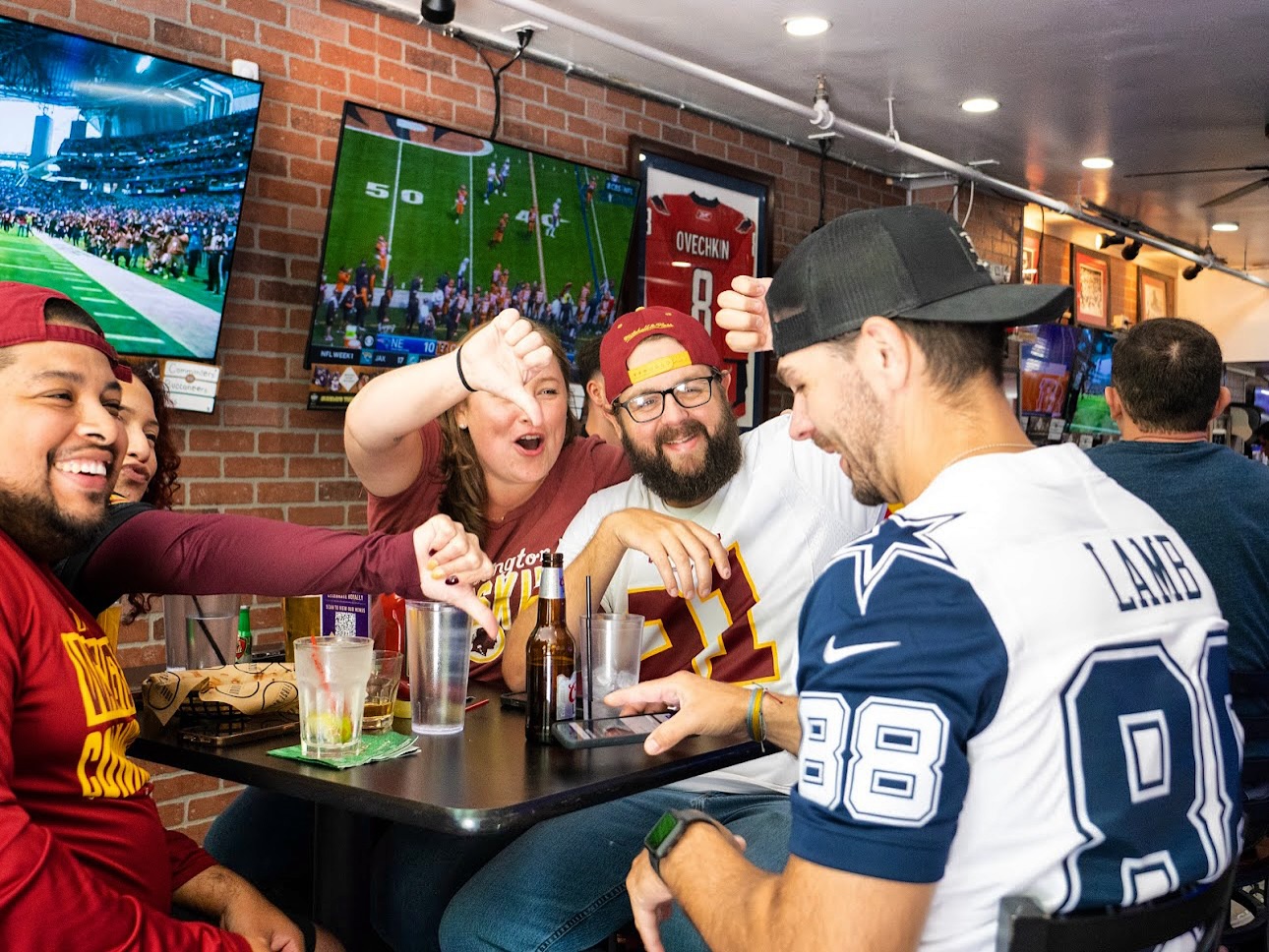 Commanders fans at First Down Sports Bar & Grill in November 2024 (via First Down/Facebook) | ARLnow