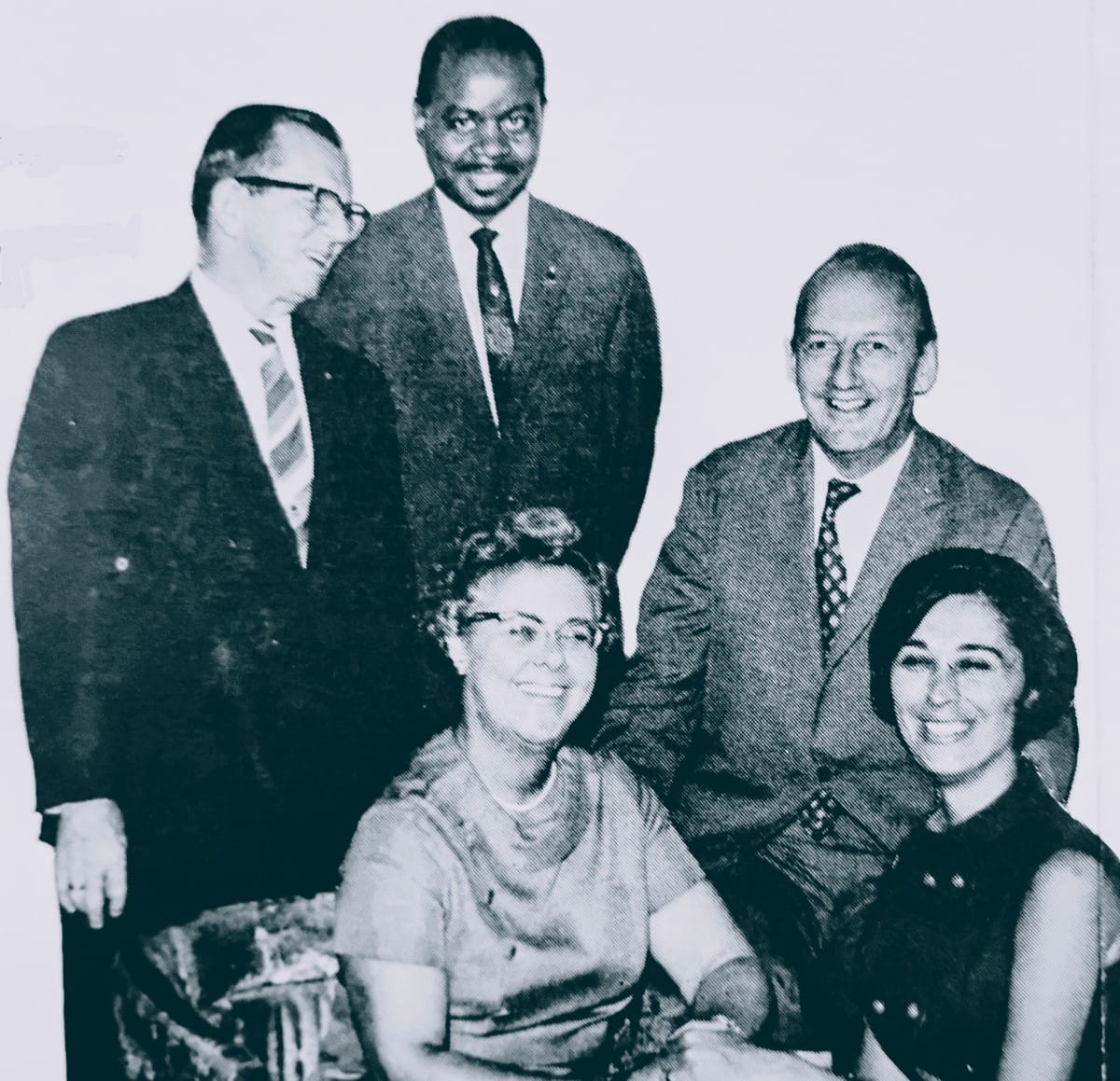 1969 Arlington House of Delegates Democratic ticket with gubernatorial candidate William Battle at right (via Charlie Clark Center for Local History) | ARLnow Five professionals posing for a group photo in suits and dresses, smiling. (five people)