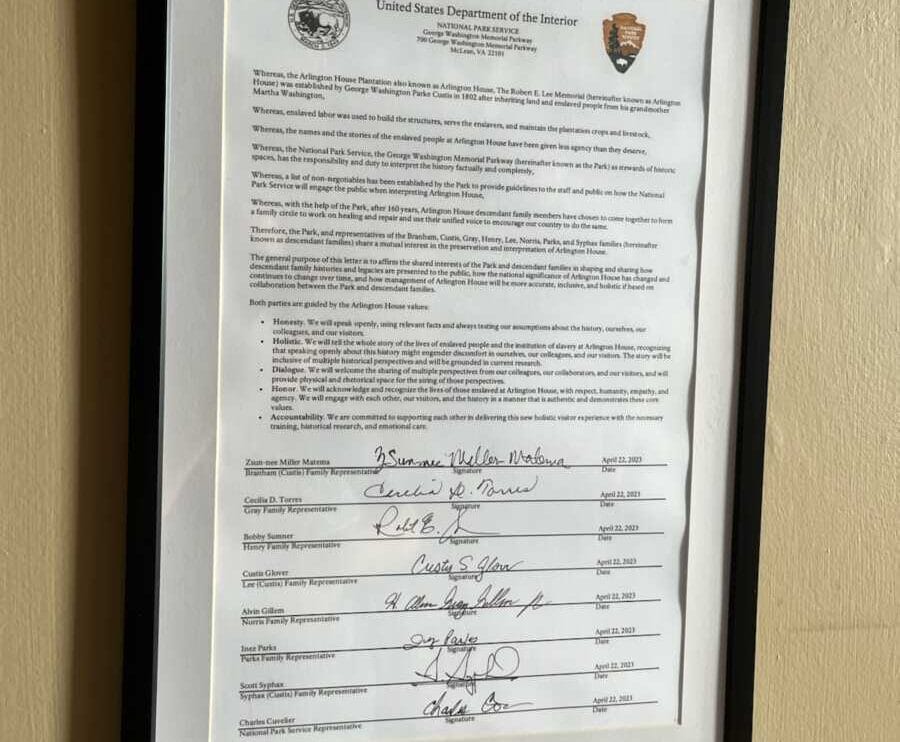 arlington house 4 | ARLnow Framed official document with seals and signatures mounted on a beige wall.