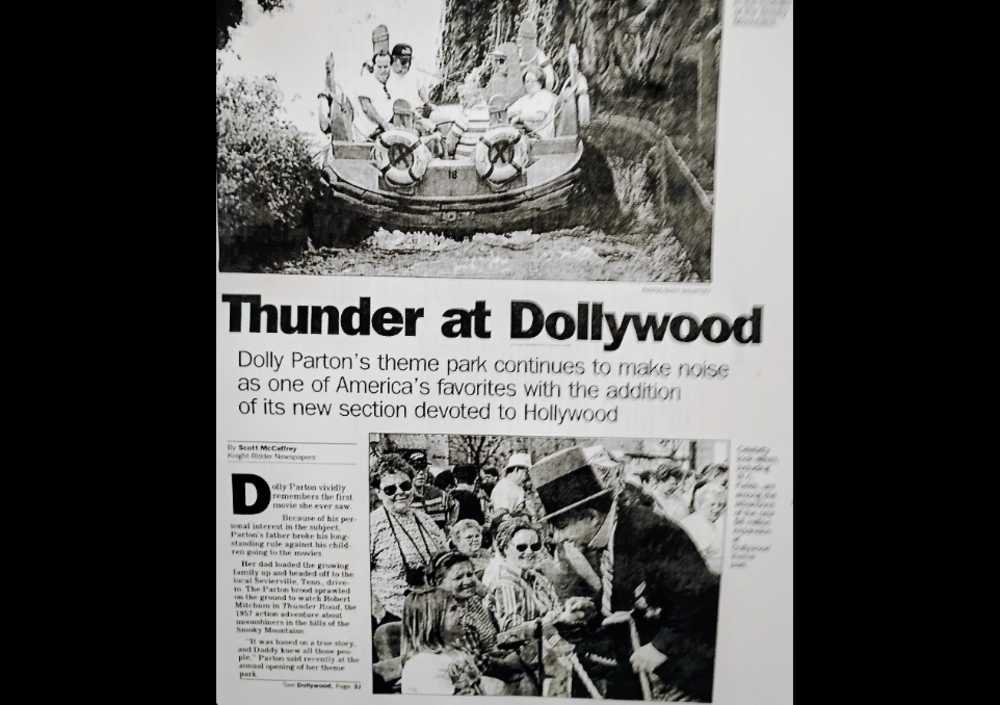 Scott McCaffrey's 1996 Dolly Parton coverage in the Birmingham News (courtesy Dollywood) | ARLnow Newspaper front page with the headline Thunder at Dollywood and photos of a river-raft ride and a crowd around a top-hatted man wondering fans.