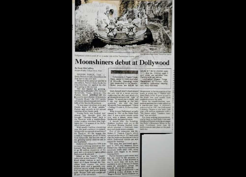 Scott McCaffrey's 1996 Dolly Parton coverage in the Los Angeles Times (courtesy Dollywood) | ARLnow Old black-and-white newspaper front page with a photo of people in a boat at the top and the headline 'Moonshiners debut at Dollywood'.