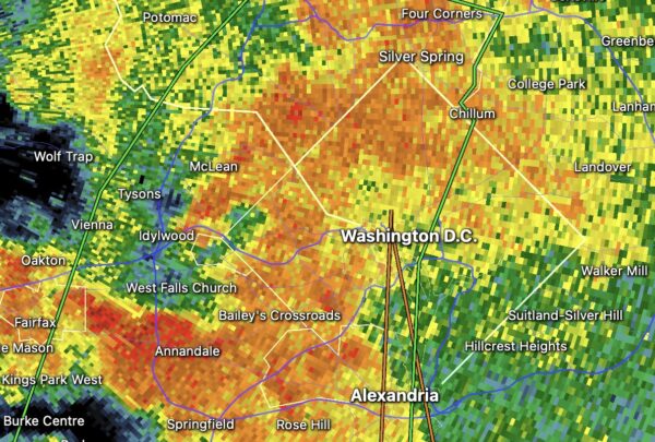 Radar map showing rainfall around Washington DC; green to red colors indicate intensity, with DC, Alexandria, Silver Spring and surrounding towns labeled.