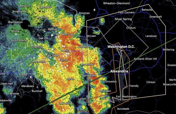 Doppler radar map showing a severe storm near DC with yellow to red precipitation and lightning icons around Fairfax, Annandale, and Woodlawn.