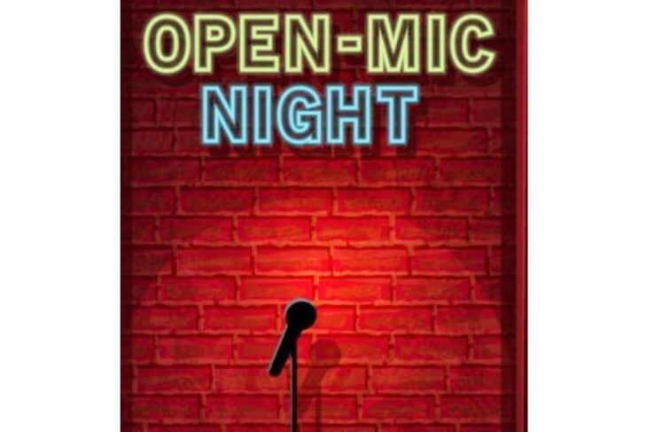 Neon sign reading OPEN-MIC NIGHT above a mic on a stand against a brick wall.