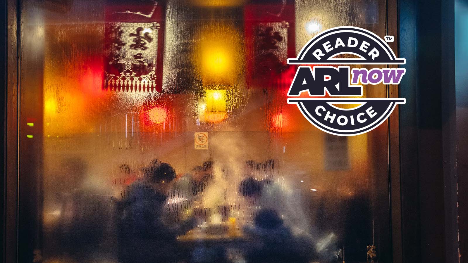 Frosted glass door with warm red and yellow lights; logo reads 'Reader AR Now AR Choice' on the right.