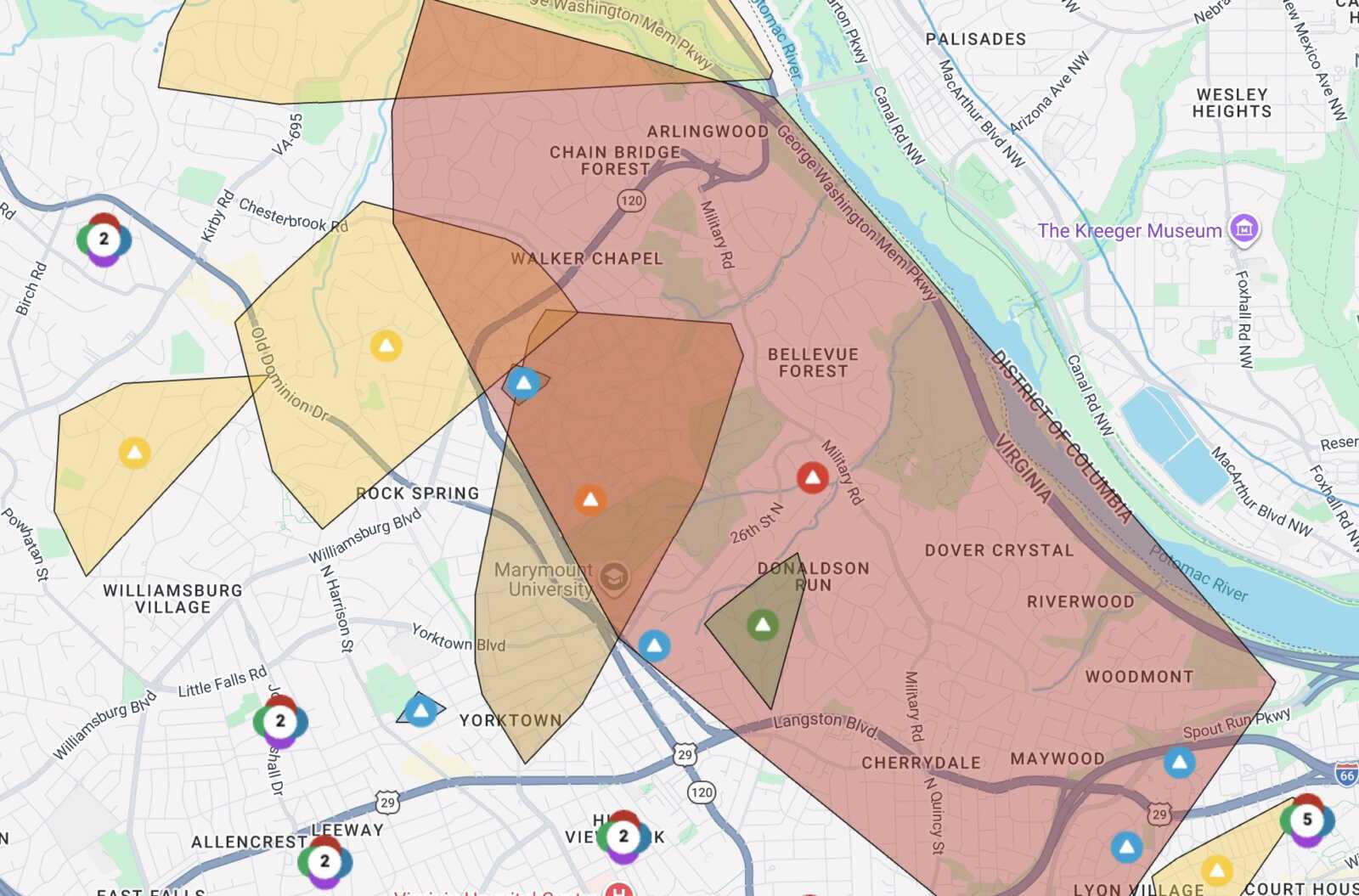 Map of a city with multiple colored polygon overlays (yellow, orange, red) covering neighborhoods and streets, plus marker icons indicating points of interest or incidents.
