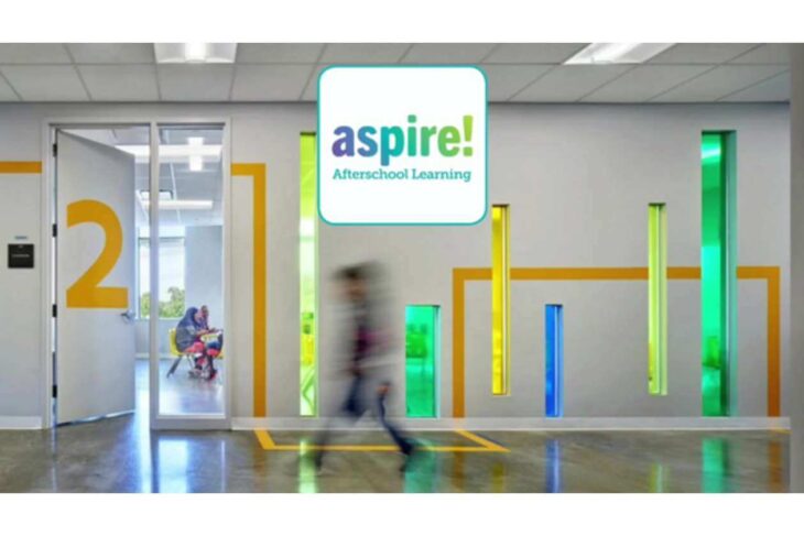 Colorful school hallway with vertical neon panels, orange '2' on the wall, a blurred student walking past, and the Aspire! Afterschool Learning logo overhead.