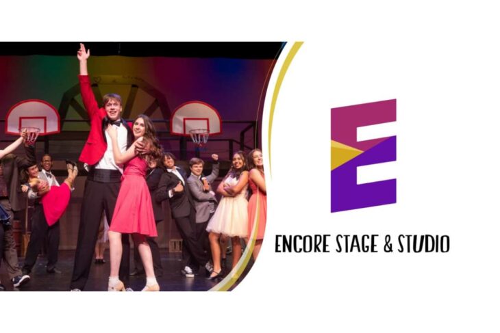 Group of young performers dancing on stage with a lead couple in red and pink, Encore Stage & Studio logo on the right.