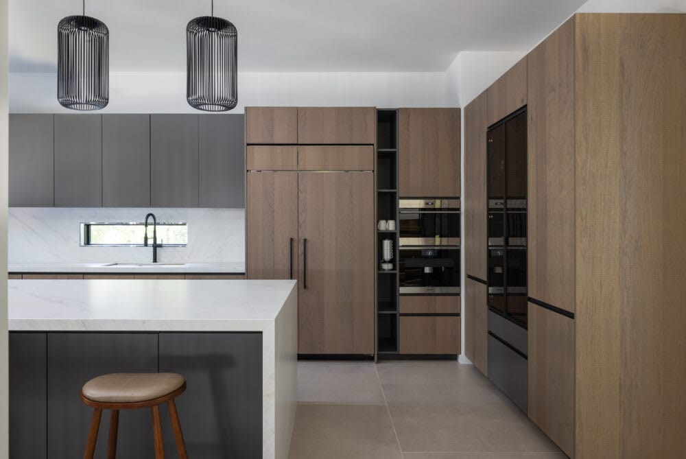 Smart refrigerators, dishwashers, ovens, and even coffee makers, such as the Miele built-in coffee machine installed in this modern custom home, can be controlled remotely, allowing you to manage your kitchen appliances from anywhere. Photo credit: Christy Kosnic Photography | ARLnow Smart refrigerators, dishwashers, ovens, and even coffee makers, such as the Miele built-in coffee machine installed in this modern custom home, can be controlled remotely, allowing you to manage your kitchen appliances from anywhere. Photo credit: Christy Kosnic Photography