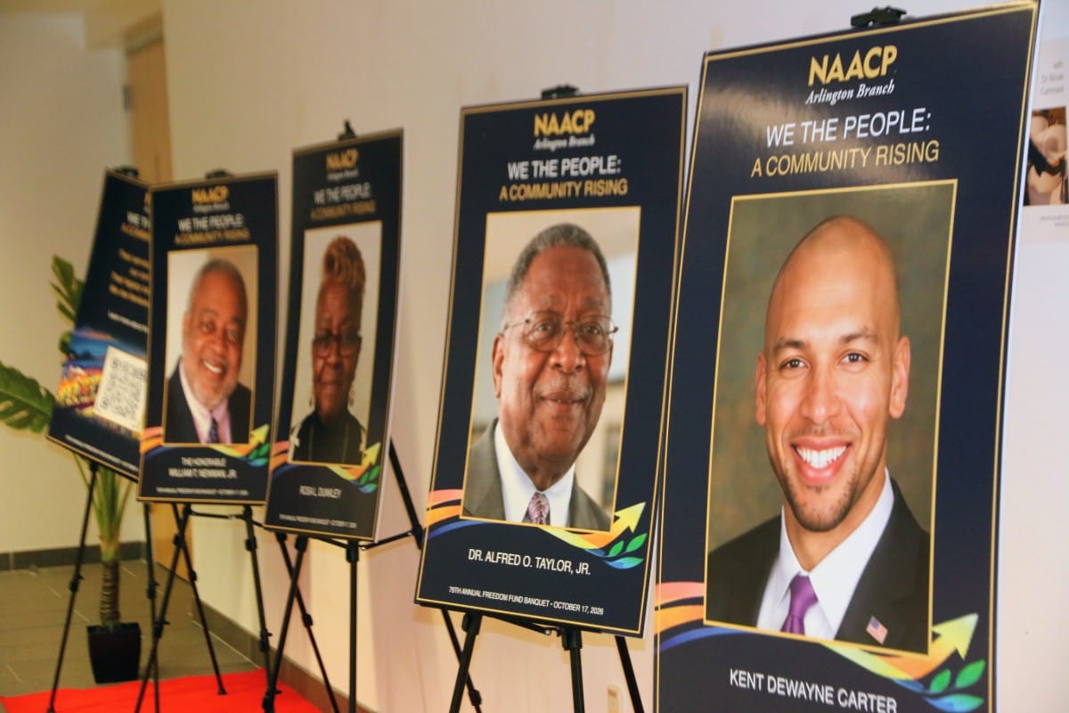 Row of large NAACP event posters on easels, each with a portrait of a honoree and event branding.