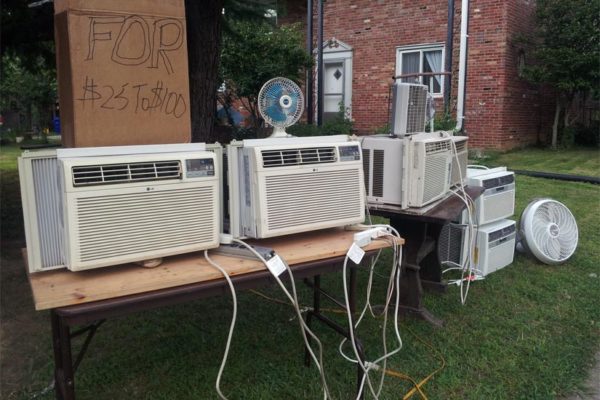 A resident sells air conditioning units at 11th and Randolph, near Ballston