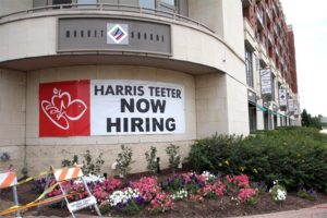 'Now Hiring' sign outside the Harris Teeter store near Potomac Yard